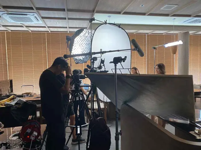 Crew reviewing footage on a production monitor